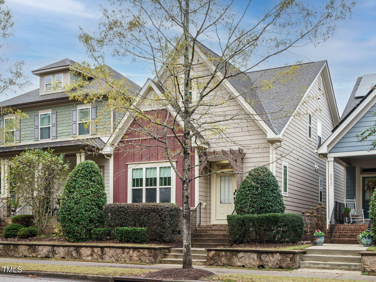 5514 Wade Park Boulevard Raleigh, NC 27607 - Photo 3 of 31 a front view of a house with plants and large trees