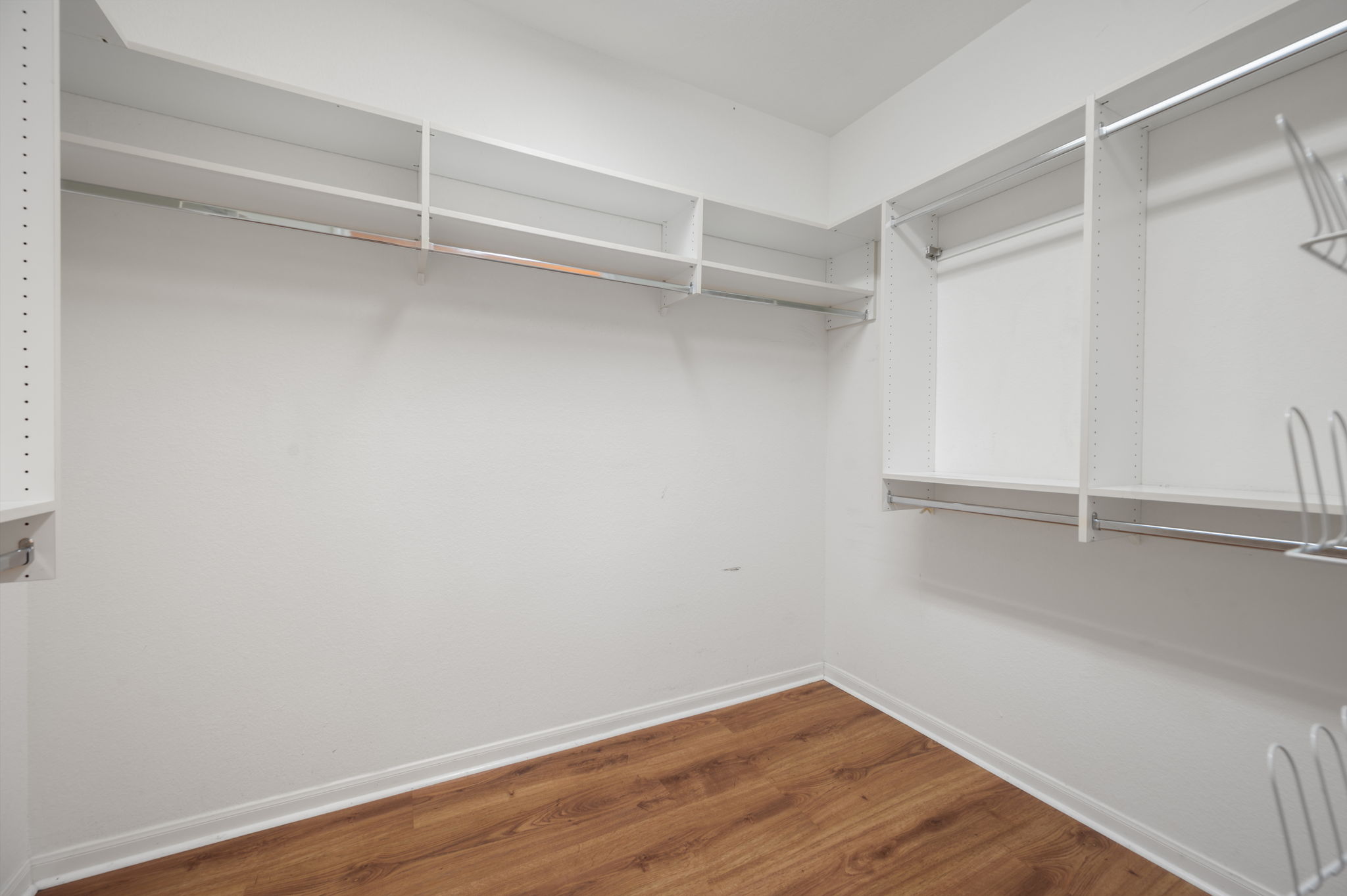 118 Bass Street Georgetown, TX 78633 - Photo 26 of 40 Ample shelving and hanging space in this well-appointed walk-in wardrobe.