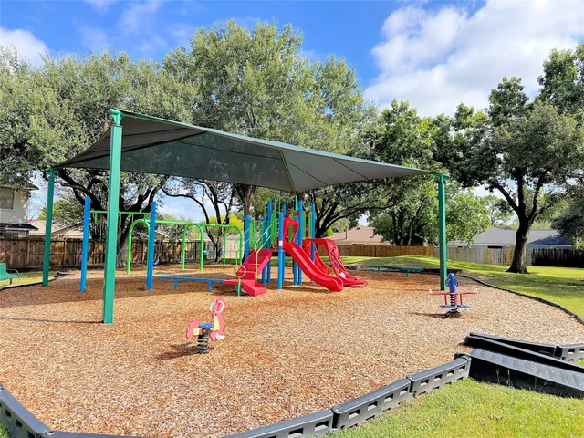 a view of park with swings