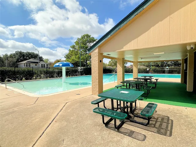 a view of a two chairs in patio and a yard