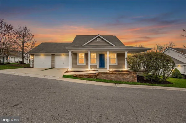 front view of a house with a yard
