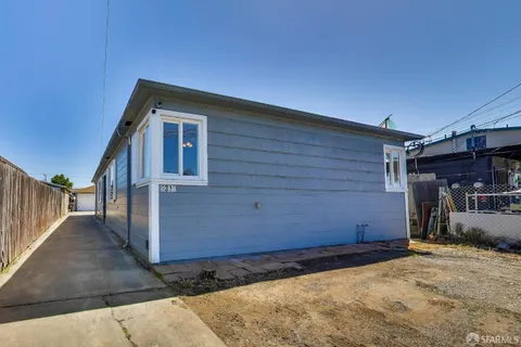 a view of a house with a backyard