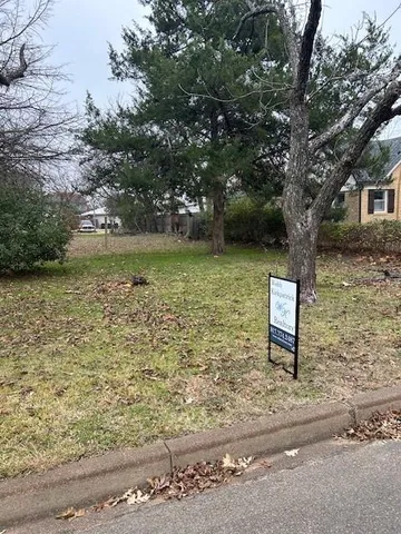 a brick building with a bench in front of it