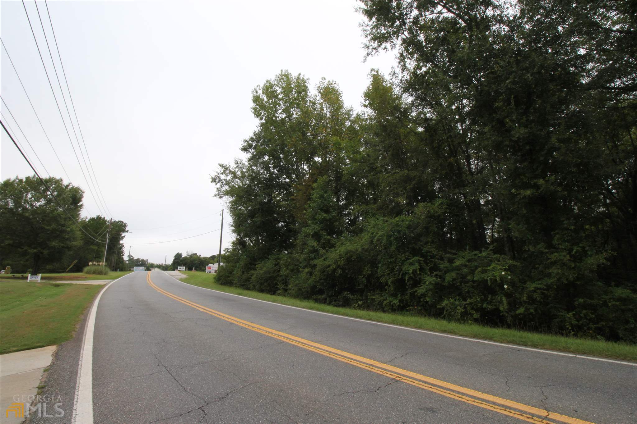 677 Dunlap Road Northeast Milledgeville, GA 31061 - Photo 5 of 7 a view of a road with a trees