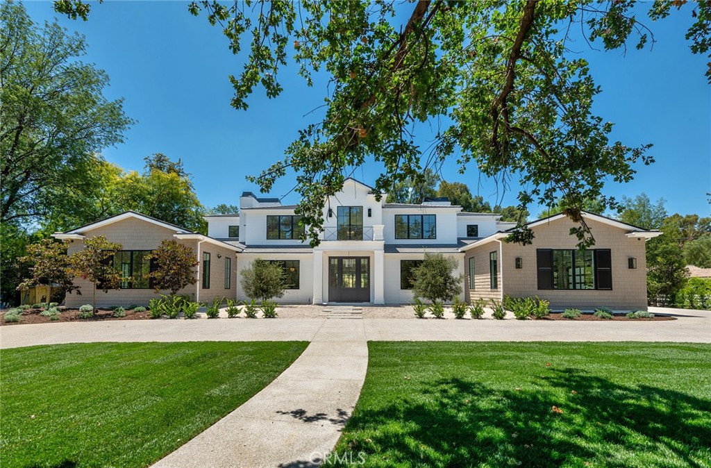 24044 Long Valley Road Hidden Hills, CA 91302 - Photo 1 of 57 a front view of a house with a yard