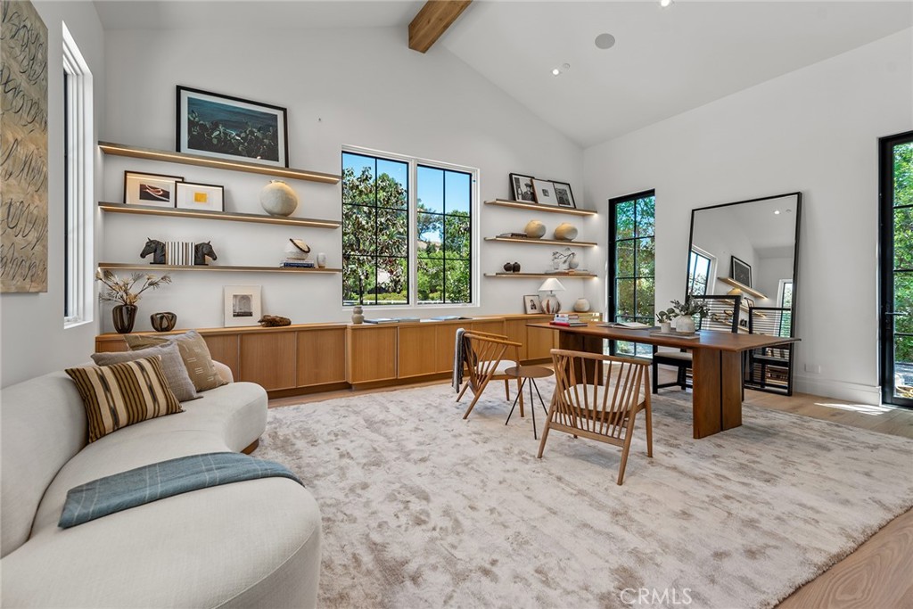 24044 Long Valley Road Hidden Hills, CA 91302 - Photo 18 of 57 a living room with furniture and a large window