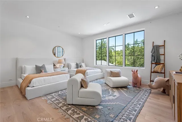 a bathroom with a sink vanity mirror and toilet