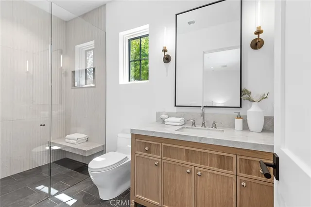 a view of a house with pool and chairs