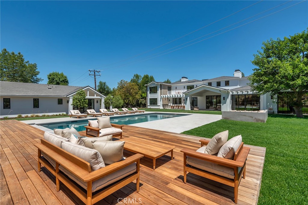 24044 Long Valley Road Hidden Hills, CA 91302 - Photo 51 of 57 a view of a house with a backyard and a sitting area