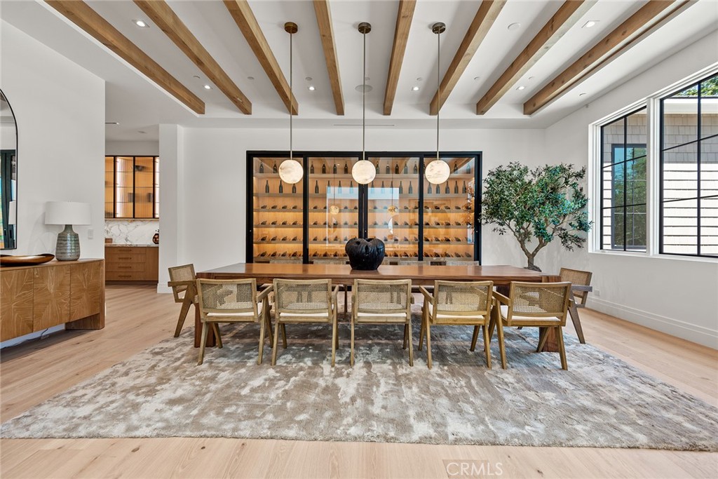 24044 Long Valley Road Hidden Hills, CA 91302 - Photo 6 of 57 a dining room with furniture a rug and a large window