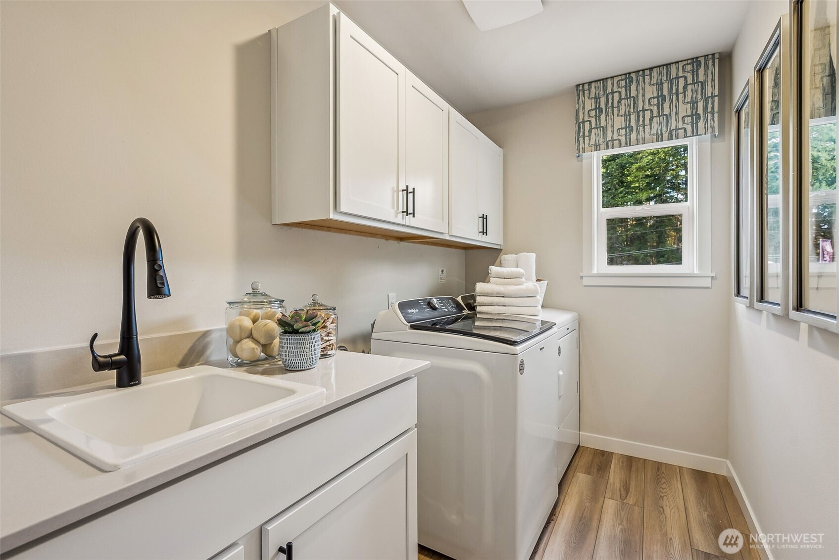 17535 Northeast Midnight Sun Loop Poulsbo, WA 98370 - Photo 20 of 38 a kitchen with a sink cabinets and window