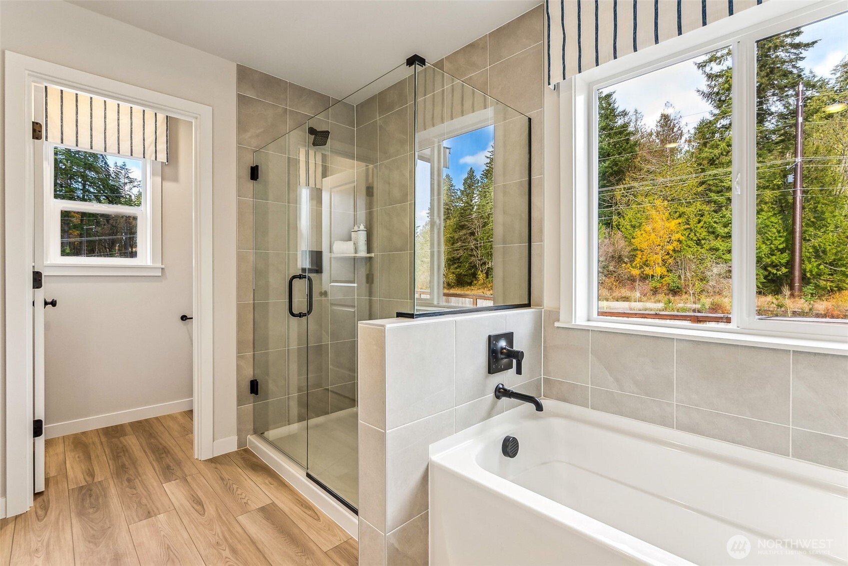 17535 Northeast Midnight Sun Loop Poulsbo, WA 98370 - Photo 24 of 38 a bathroom with a bathtub and a shower