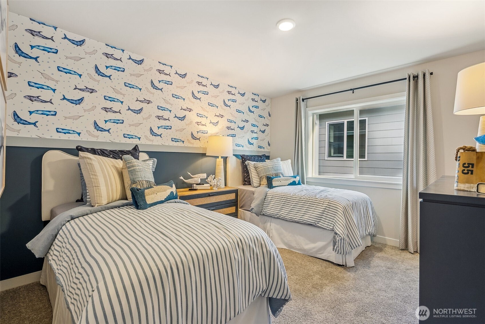 17535 Northeast Midnight Sun Loop Poulsbo, WA 98370 - Photo 27 of 38 a bedroom with two beds and painting on the wall