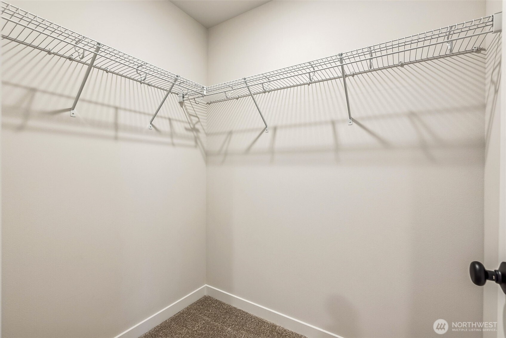 17535 Northeast Midnight Sun Loop Poulsbo, WA 98370 - Photo 28 of 38 a view of a room with racks on the wall