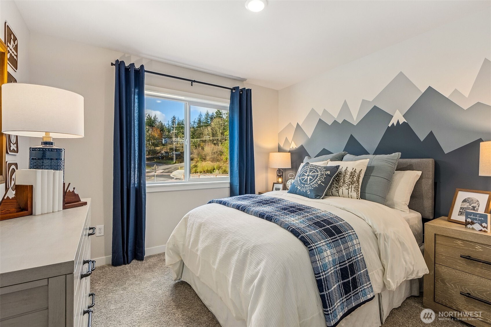 17535 Northeast Midnight Sun Loop Poulsbo, WA 98370 - Photo 29 of 38 a bedroom with a bed and a large window