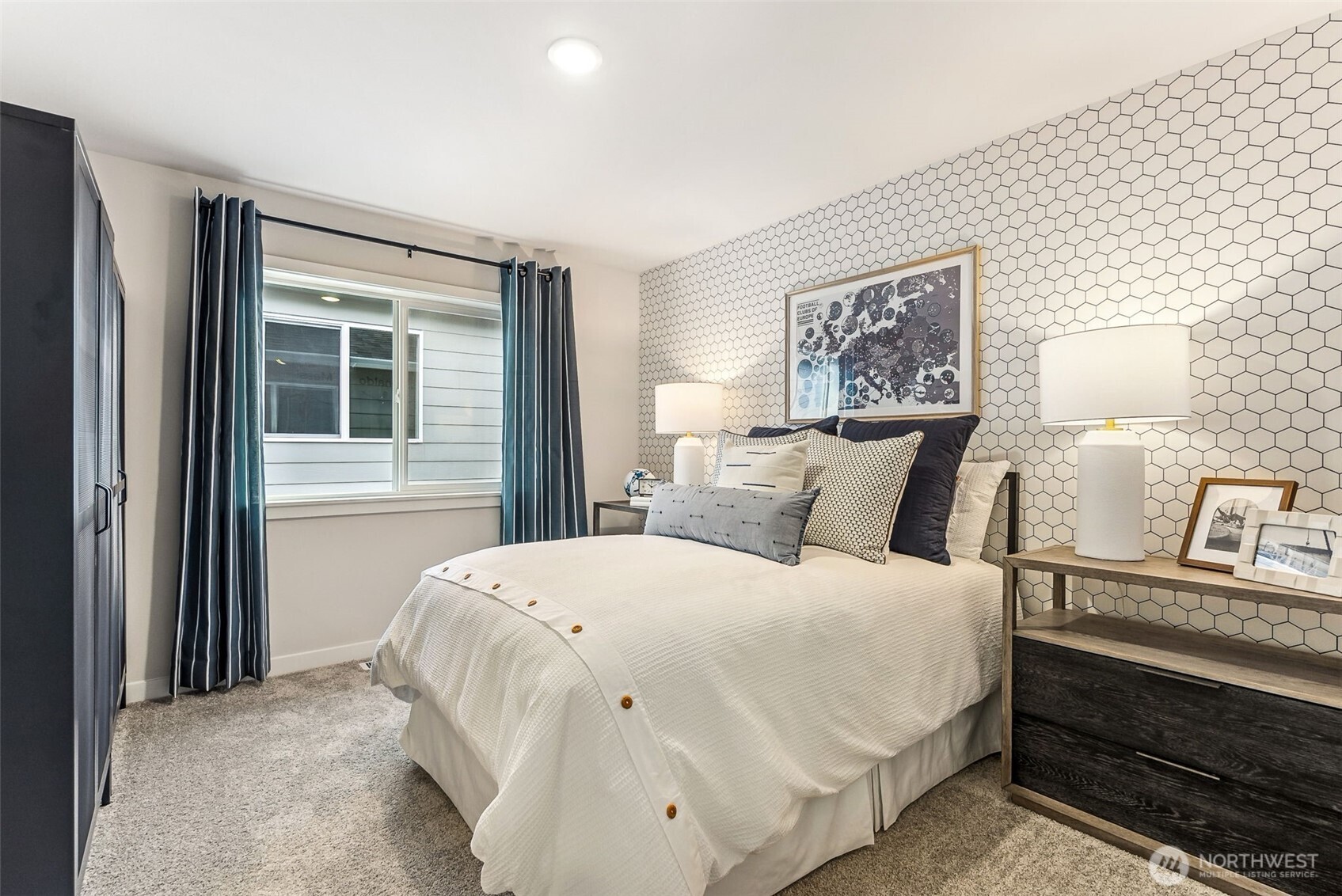 17535 Northeast Midnight Sun Loop Poulsbo, WA 98370 - Photo 30 of 38 a bedroom with a bed and a window