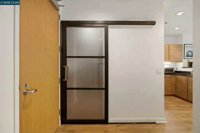 a view of a kitchen with a refrigerator and a stove