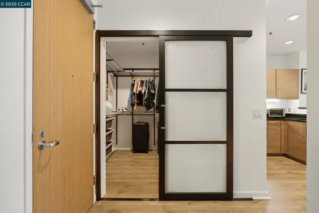 a view of a kitchen with a refrigerator and a stove