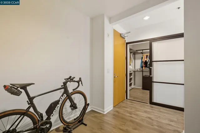 a bathroom with a granite countertop sink and a refrigerator