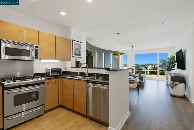 a view of a hallway with a livingroom and furniture