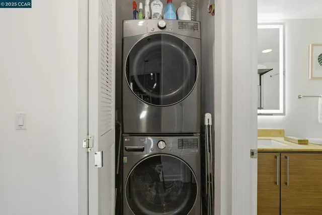 a view of a hallway with washer and dryer