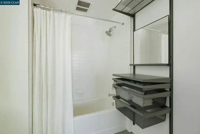 a front view of a building with a garden