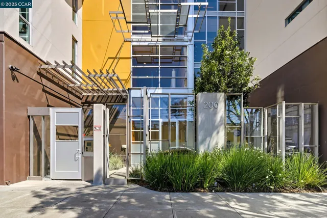 a view of backyard with wheel chair potted plants and wooden fence