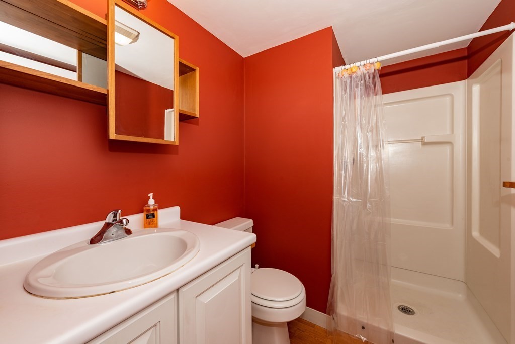 4 Raintree Circle, Unit 4D Brockton, MA 02302 - Photo 7 of 24 a bathroom with a sink toilet and shower