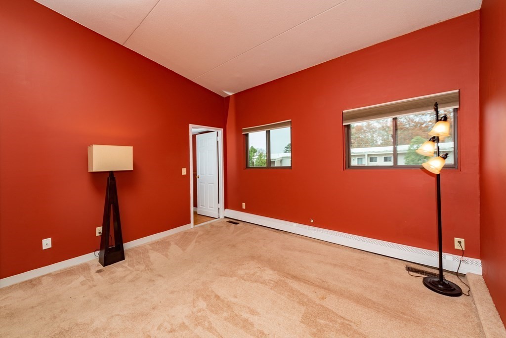 4 Raintree Circle, Unit 4D Brockton, MA 02302 - Photo 8 of 24 a view of an empty room with windows