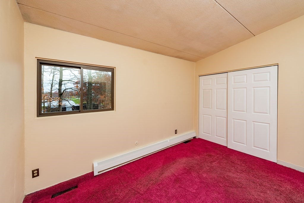 4 Raintree Circle, Unit 4D Brockton, MA 02302 - Photo 10 of 24 an empty room with a window