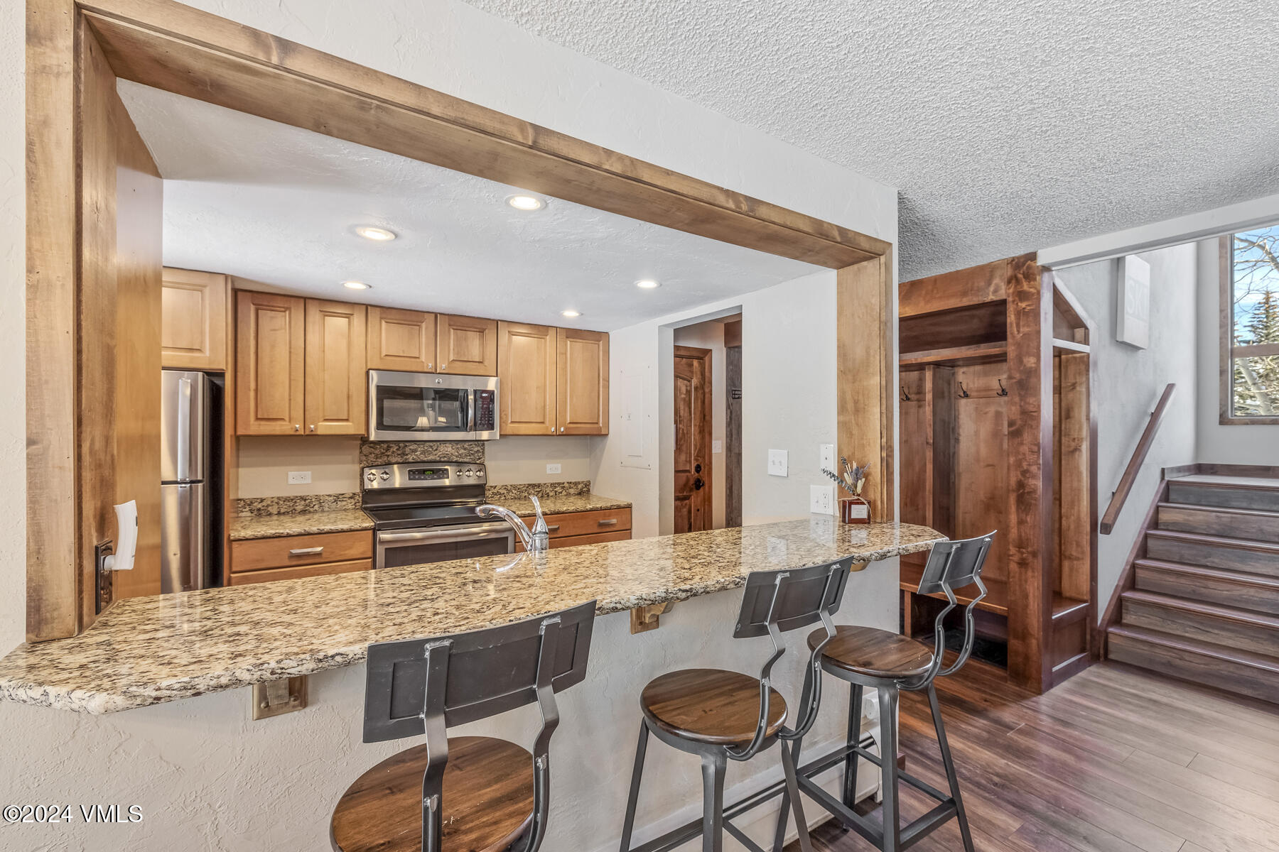 4516 Meadow Drive, Unit 809 Vail, CO 81657 - Photo 16 of 26 Kitchen Foyer & Stairs