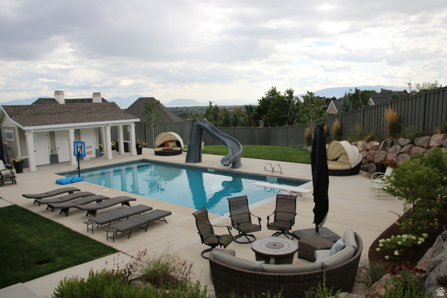 7 Elk Court Alpine, UT 84004 - Photo 2 of 10 Outdoor swimming pool featuring a diving board and attached slide