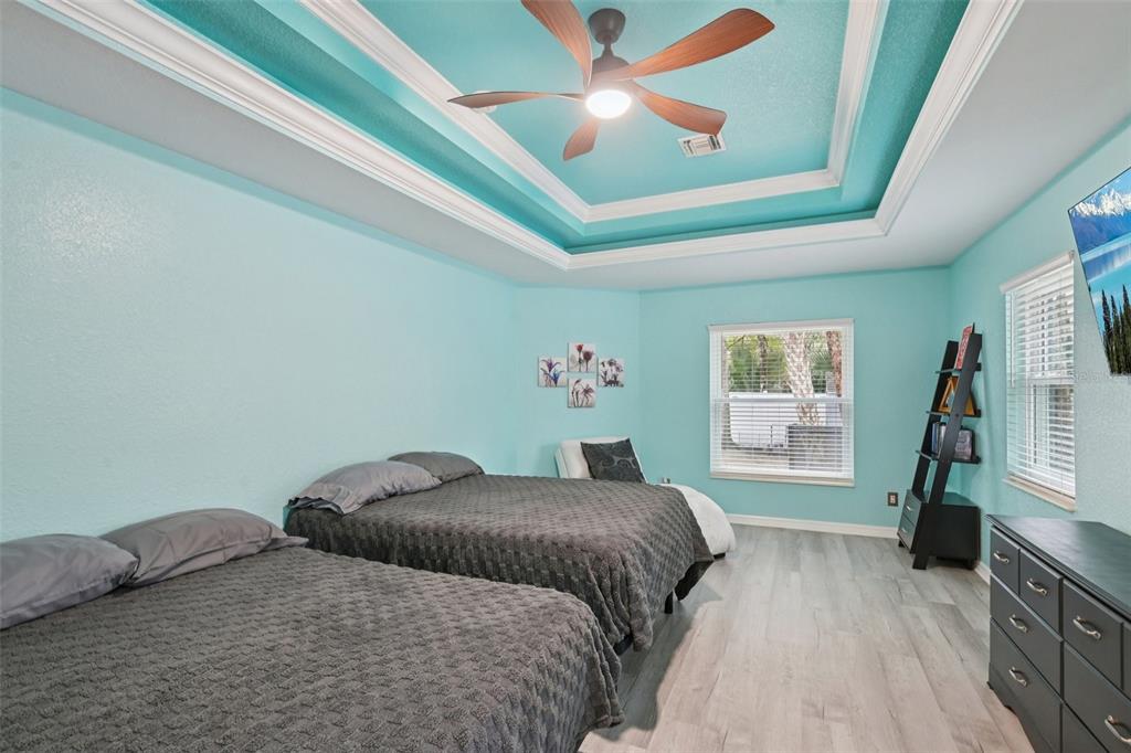 4337 Langsom Lane North Port, FL 34286 - Photo 19 of 42 a bedroom with a large bed and a window