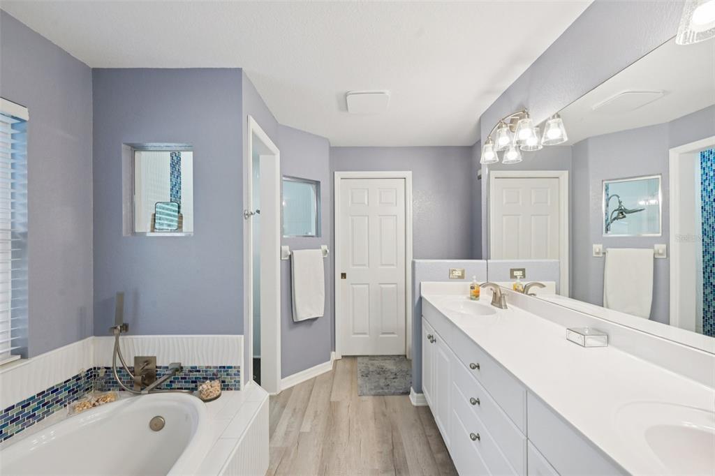 4337 Langsom Lane North Port, FL 34286 - Photo 22 of 42 a spacious bathroom with a double vanity sink mirror and double