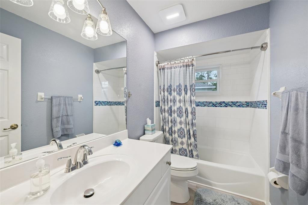 4337 Langsom Lane North Port, FL 34286 - Photo 27 of 42 a bathroom with a sink a toilet and shower