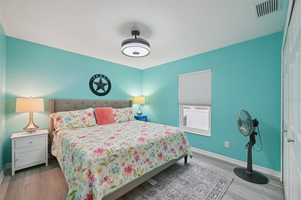 4337 Langsom Lane North Port, FL 34286 - Photo 28 of 42 a bedroom with a bed and a table