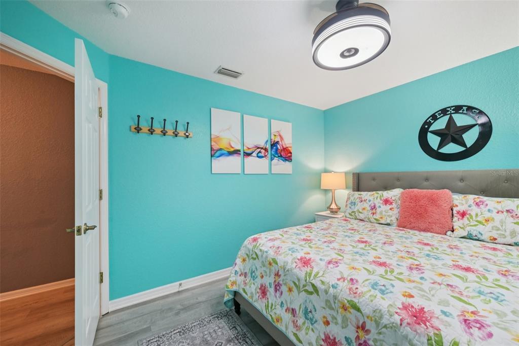 4337 Langsom Lane North Port, FL 34286 - Photo 29 of 42 a bedroom with a bed and a painting on the wall