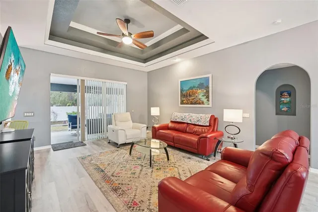 a living room with furniture or couch and a large window