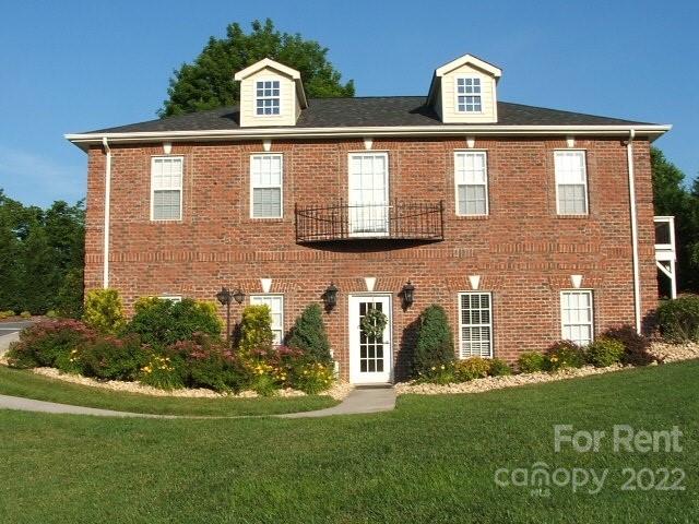 2310 Hickory Boulevard, Unit B Lenoir, NC 28645 - Photo 1 of 11 a front view of a house with a yard