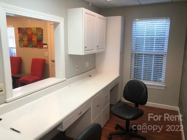 a kitchen with granite countertop cabinets and a stove