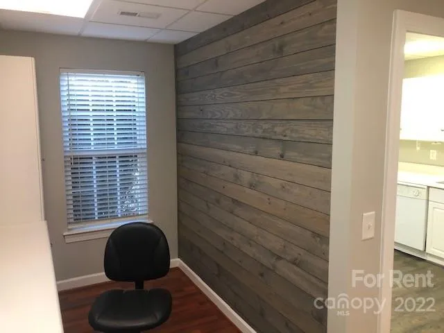 a bathroom with a toilet and a window
