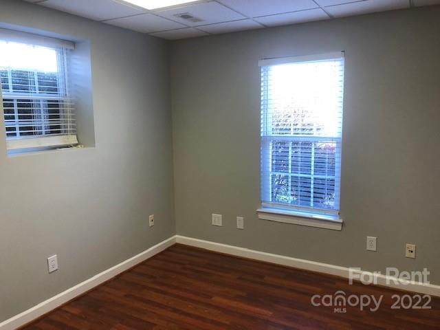 2310 Hickory Boulevard, Unit B Lenoir, NC 28645 - Photo 5 of 11 an empty room with wooden floor and windows
