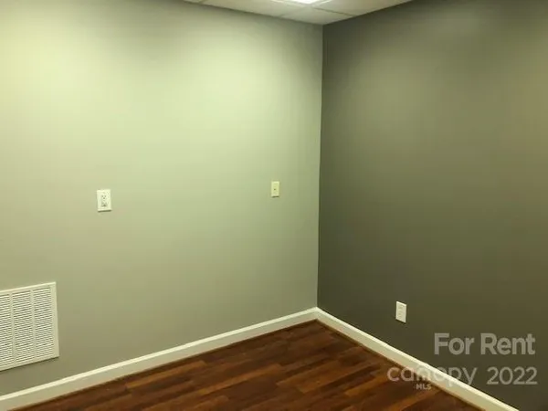 a view of a small space with wooden floor