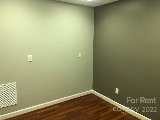 a view of a small space with wooden floor