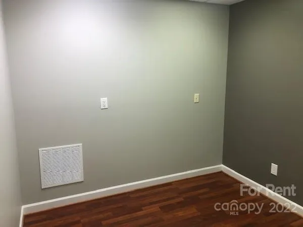 a view of a small space with wooden floor