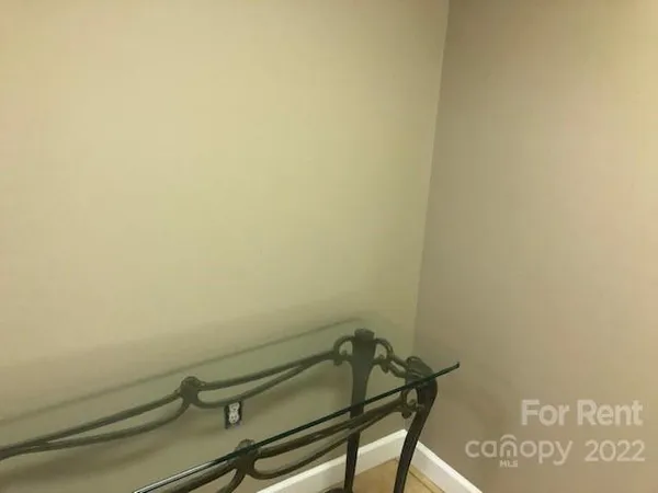 a view of a room with rack on the wall