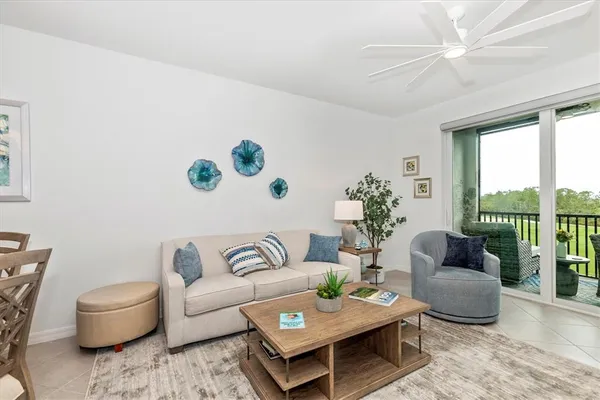 a living room with furniture and a garden