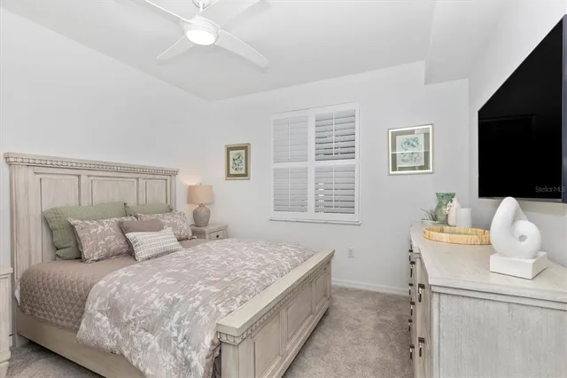 a front view of a building with a garden