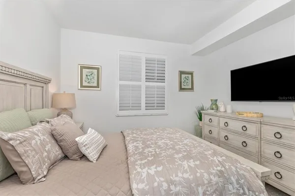 a view of a garden with a building in the background