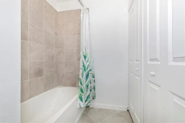 a building outdoor space with patio furniture and potted plants